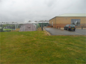 Photograph showing the cark park at a garden centre